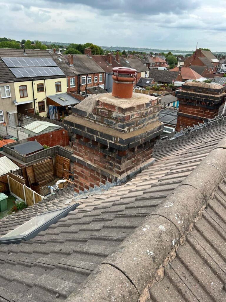 This is a photo taken from a roof which is being repaired by Hucknall Roofing Repairs, it shows a street of houses, and their roofs